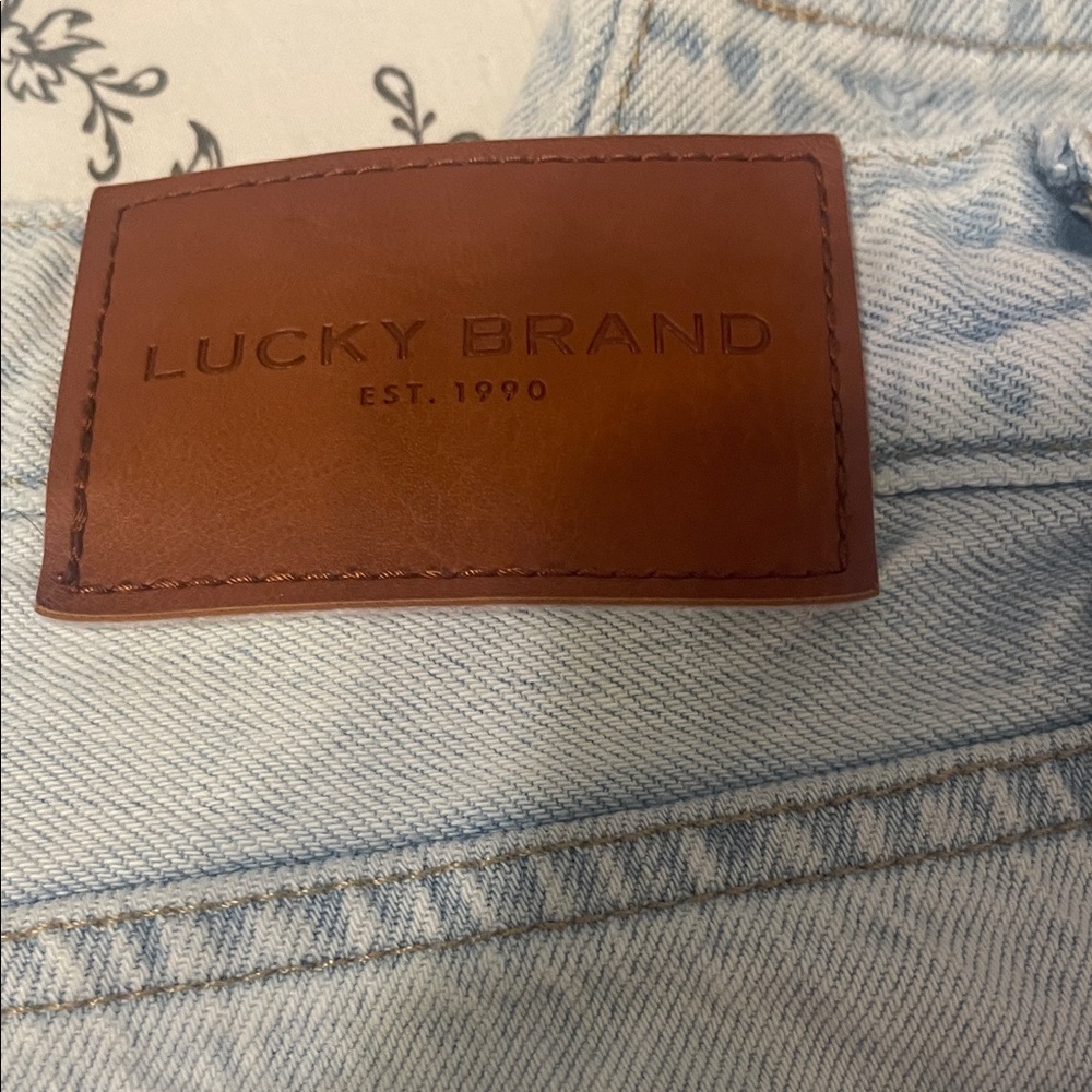 Lucky Brand Light Blue High Rise Jeans with Brown Leather Patch